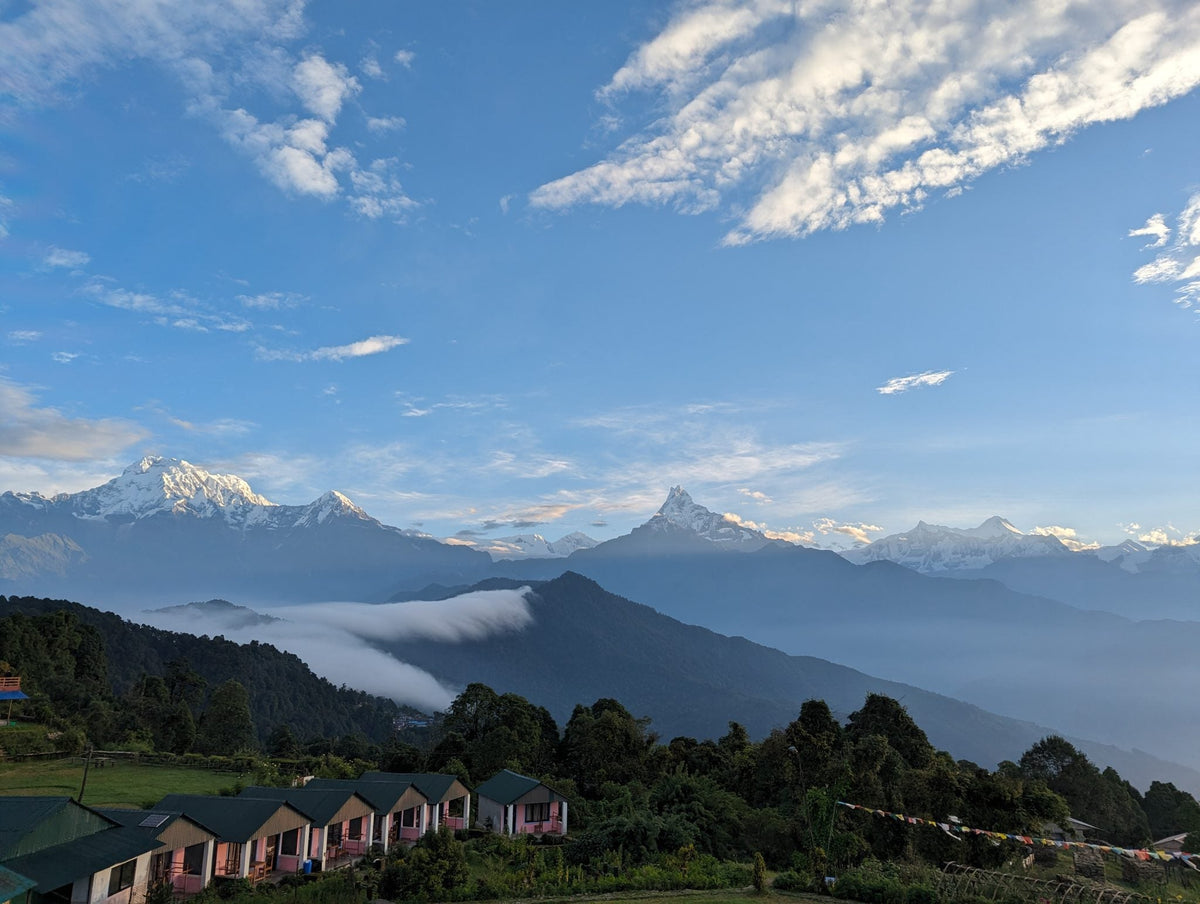 Snow peaks above cloud